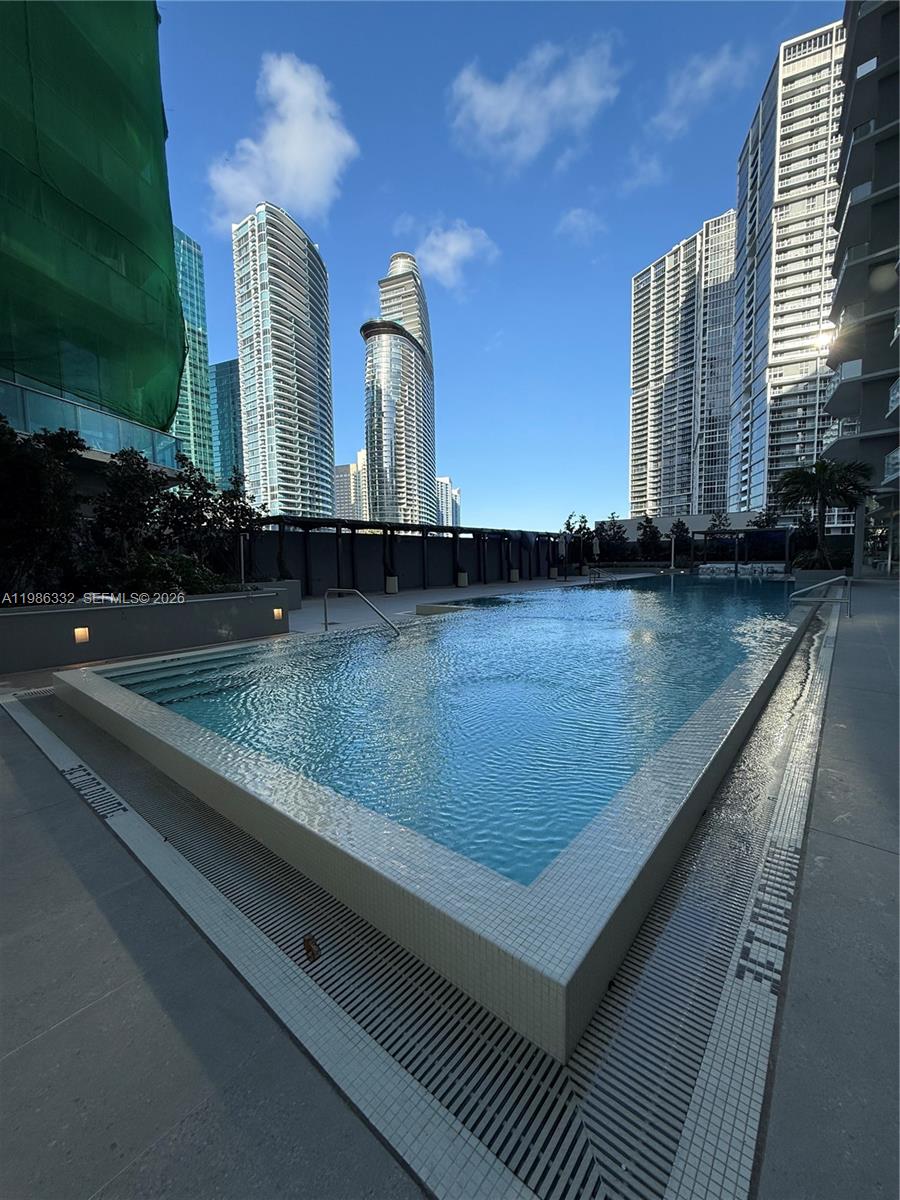 77 Southeast 5th Street, Unit 2015 Miami, FL 33131 - Photo 33 of 70 swimming pool with outdoor seating and plants