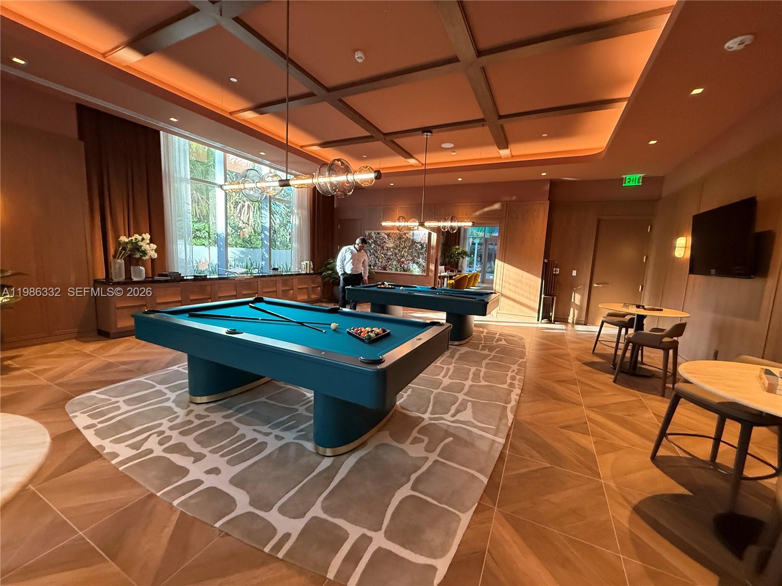 77 Southeast 5th Street, Unit 2015 Miami, FL 33131 - Photo 38 of 70 a outdoor space with a large pool table and chairs
