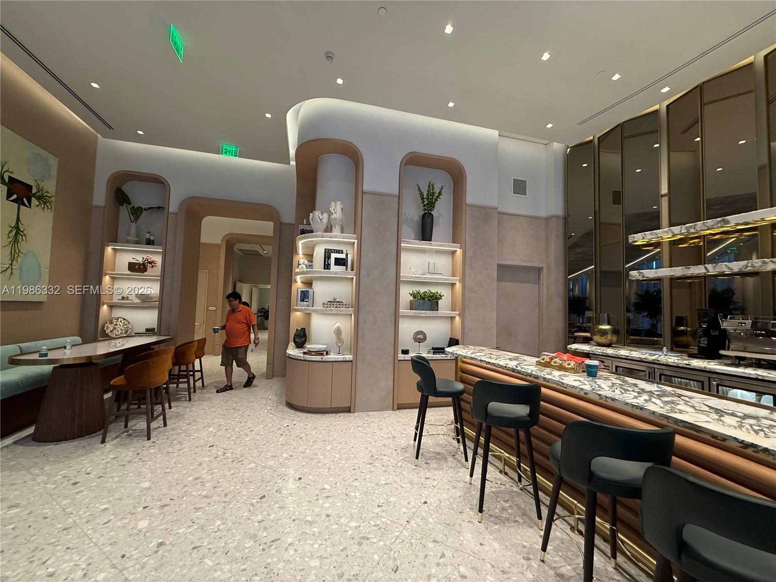 77 Southeast 5th Street, Unit 2015 Miami, FL 33131 - Photo 41 of 70 a room with furniture cabinetry and wall