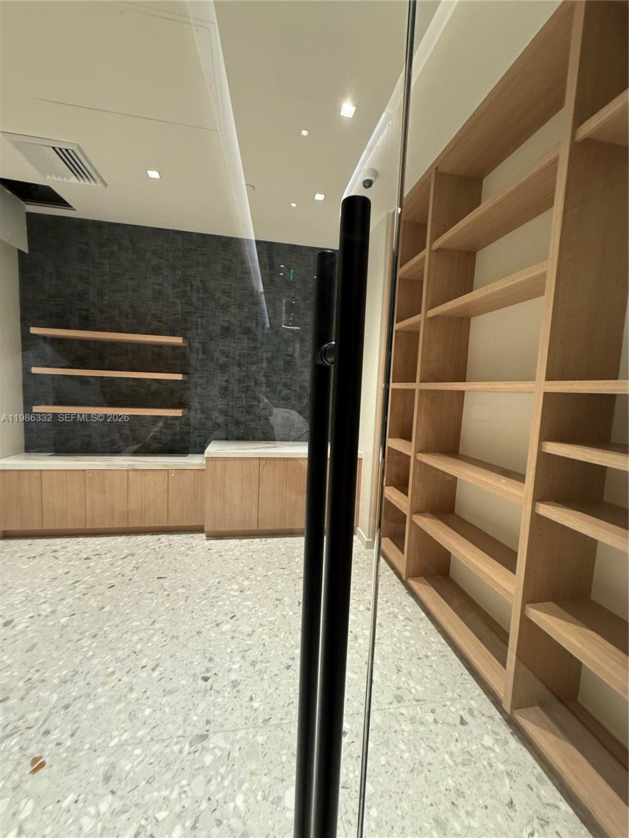 77 Southeast 5th Street, Unit 2015 Miami, FL 33131 - Photo 54 of 70 a view of hallway with stairs and a wooden floor