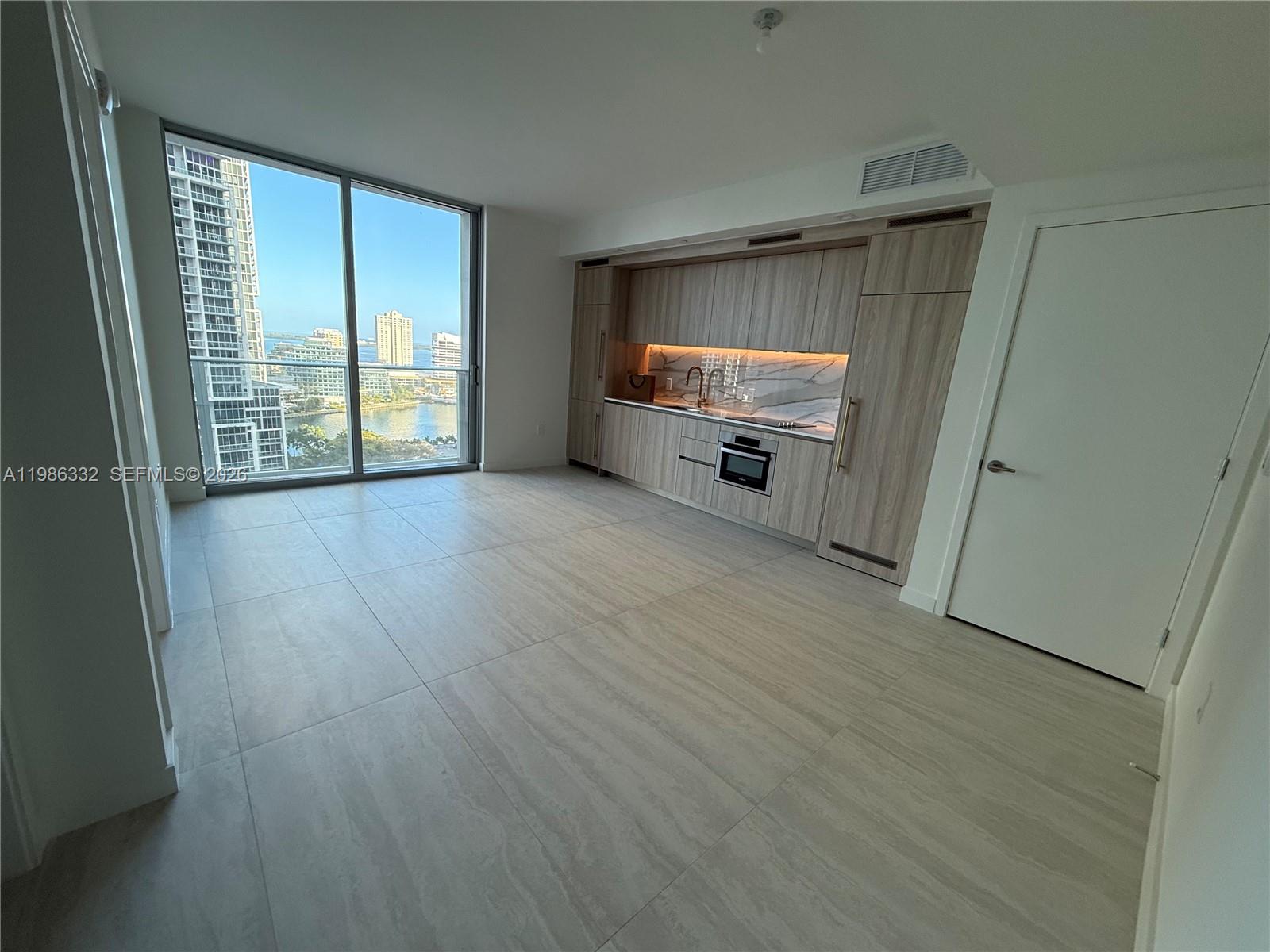 77 Southeast 5th Street, Unit 2015 Miami, FL 33131 - Photo 10 of 70 a view of an empty room with a window