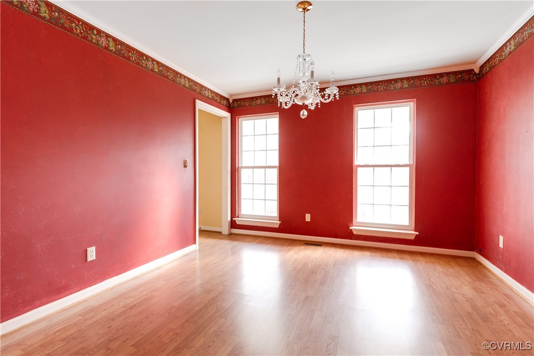 4588 Broad St Road Gum Spring, VA 23065 - Photo 12 of 50 a view of an empty room with wooden floor and a window