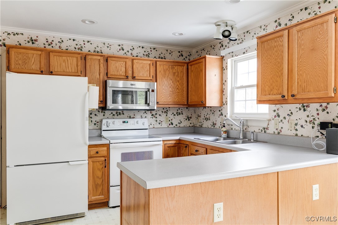 4588 Broad St Road Gum Spring, VA 23065 - Photo 18 of 50 a kitchen with stainless steel appliances a stove a sink and a refrigerator