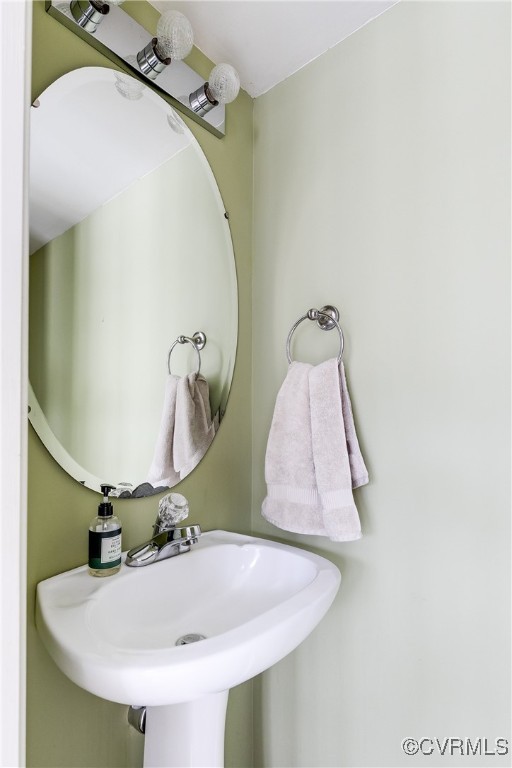 4588 Broad St Road Gum Spring, VA 23065 - Photo 20 of 50 a bathroom with a sink and mirror