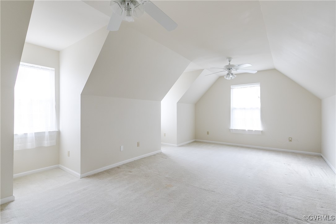 4588 Broad St Road Gum Spring, VA 23065 - Photo 33 of 50 an empty room with windows and chandelier fan