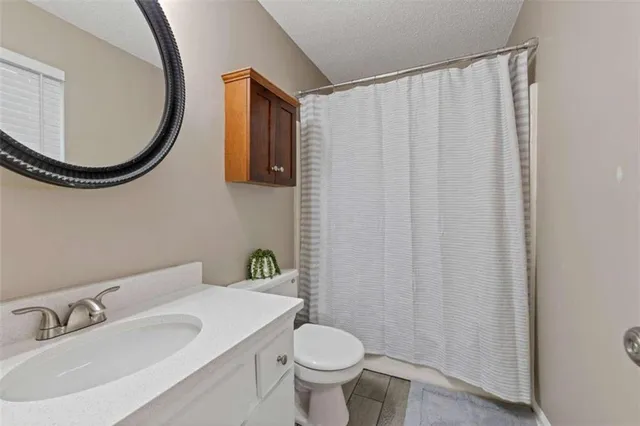 a bathroom with a toilet and a sink