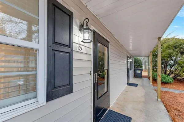 a view of a hallway with wooden walls and staircase