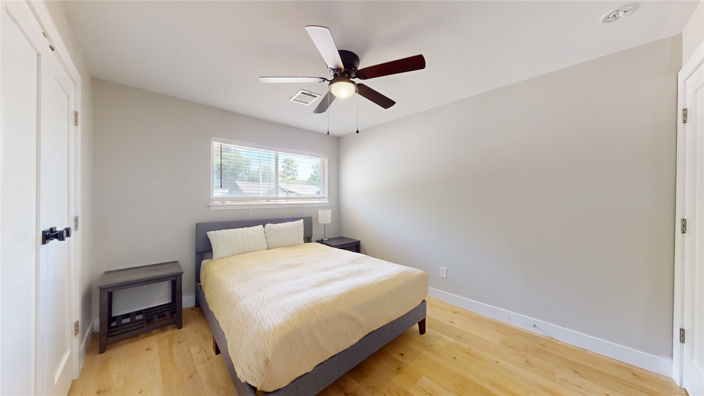 5455 Birdwood Road Houston, TX 77096 - Photo 17 of 26 a bedroom with a bed and window