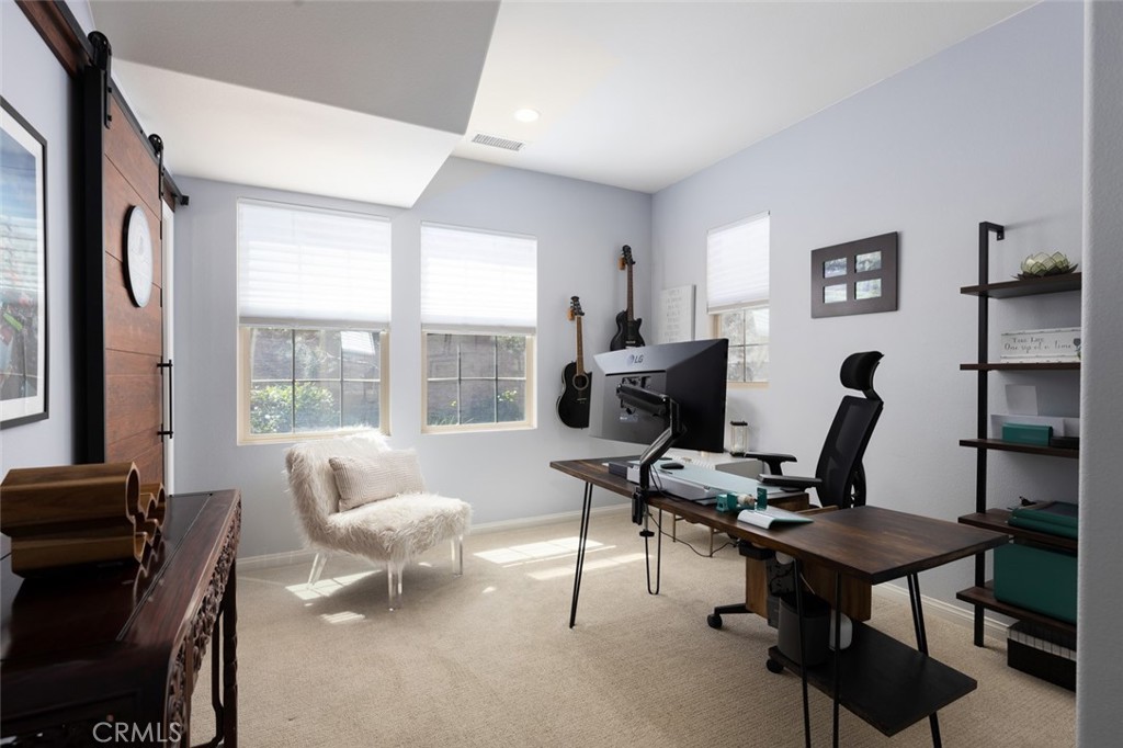 193 Barnes Road Tustin, CA 92782 - Photo 13 of 45 a view of a workspace with furniture and a window