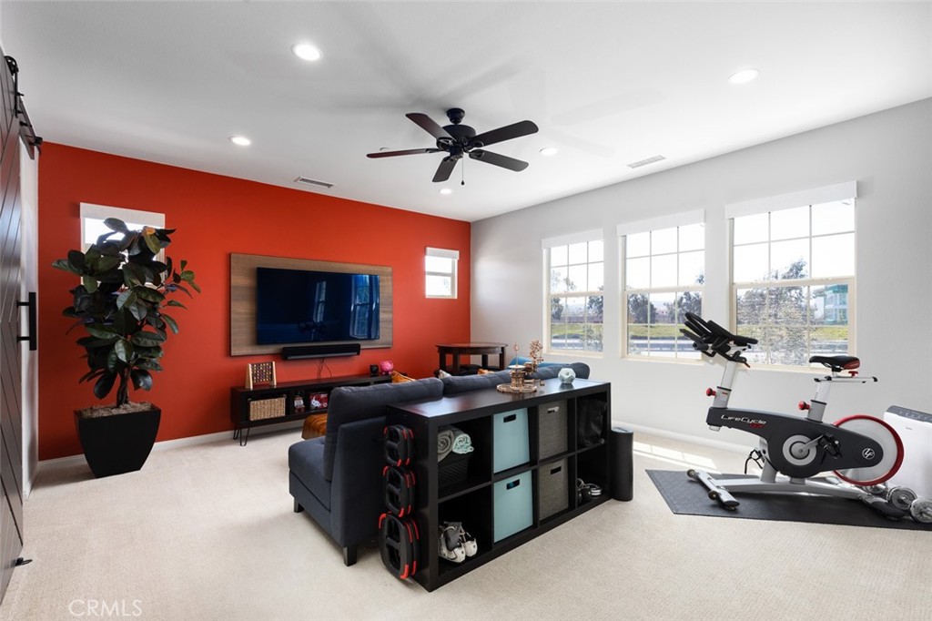 193 Barnes Road Tustin, CA 92782 - Photo 18 of 45 a living room with furniture a flat screen tv and a large window