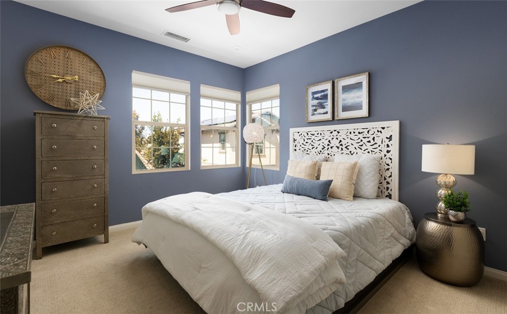 193 Barnes Road Tustin, CA 92782 - Photo 21 of 45 a bedroom with a bed and a painting on the wall