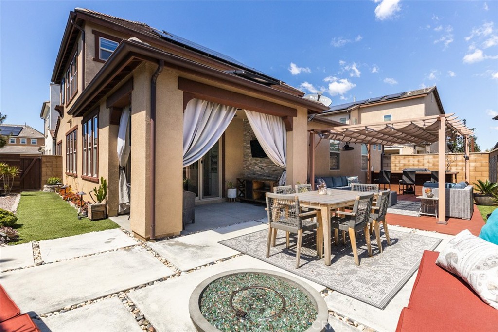 193 Barnes Road Tustin, CA 92782 - Photo 30 of 45 a view of a dinning table and chairs in the patio