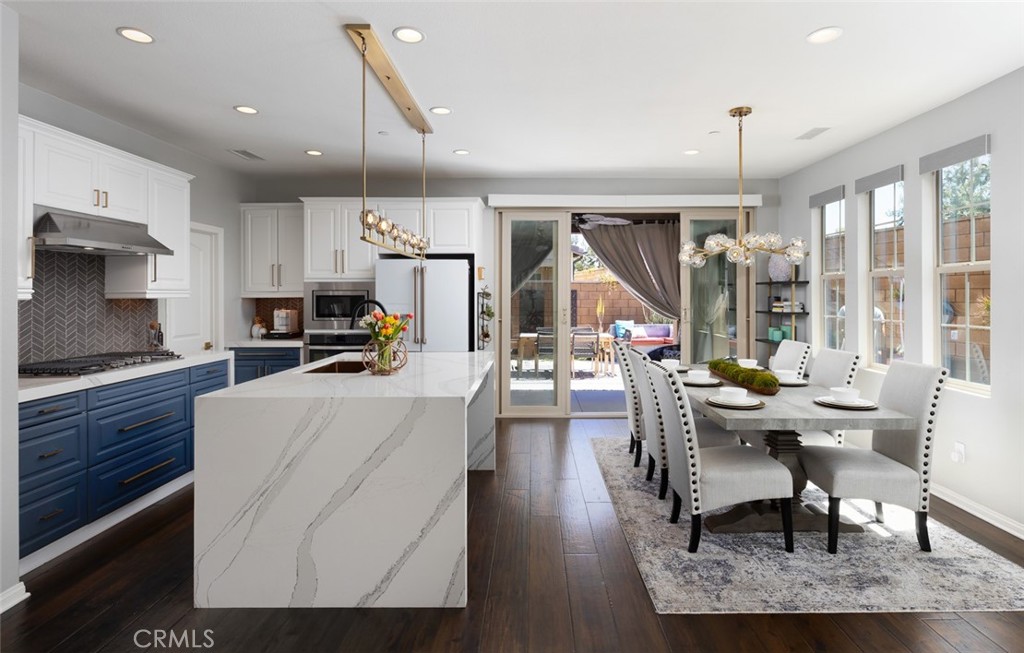 193 Barnes Road Tustin, CA 92782 - Photo 4 of 45 a living room with stainless steel appliances kitchen island granite countertop furniture and a kitchen view