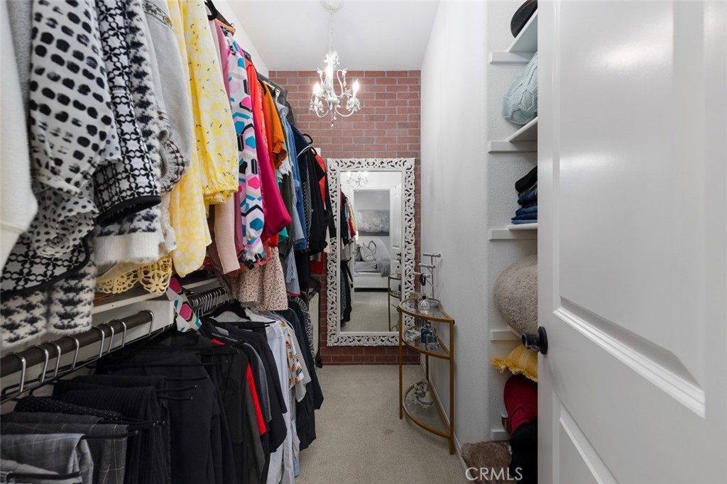 193 Barnes Road Tustin, CA 92782 - Photo 10 of 45 a view of walk in closet with clothes