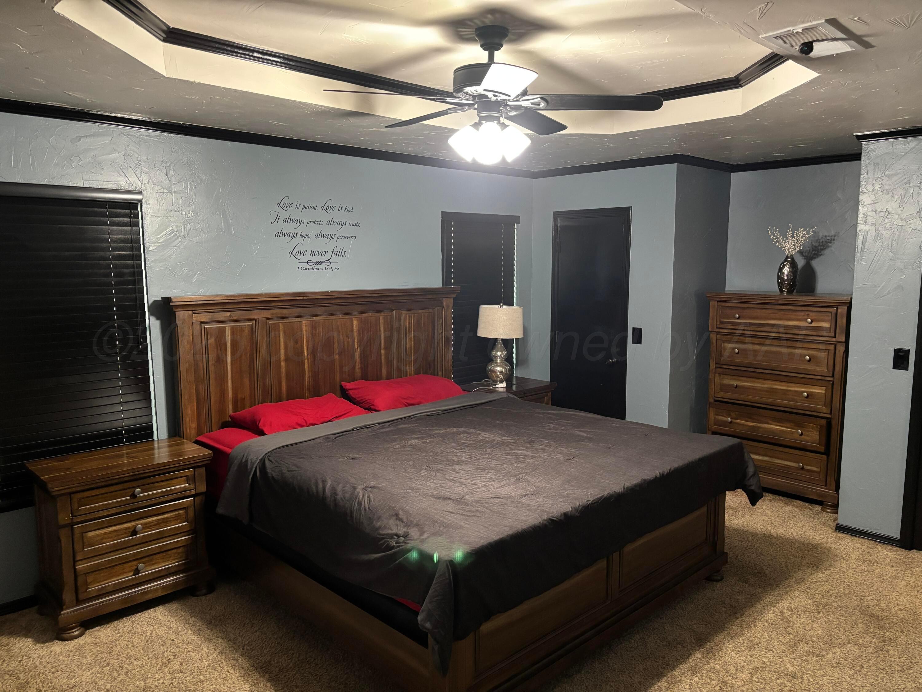 7810 Farrell Drive Amarillo, TX 79121 - Photo 17 of 31 a bed room with a bed and a dresser