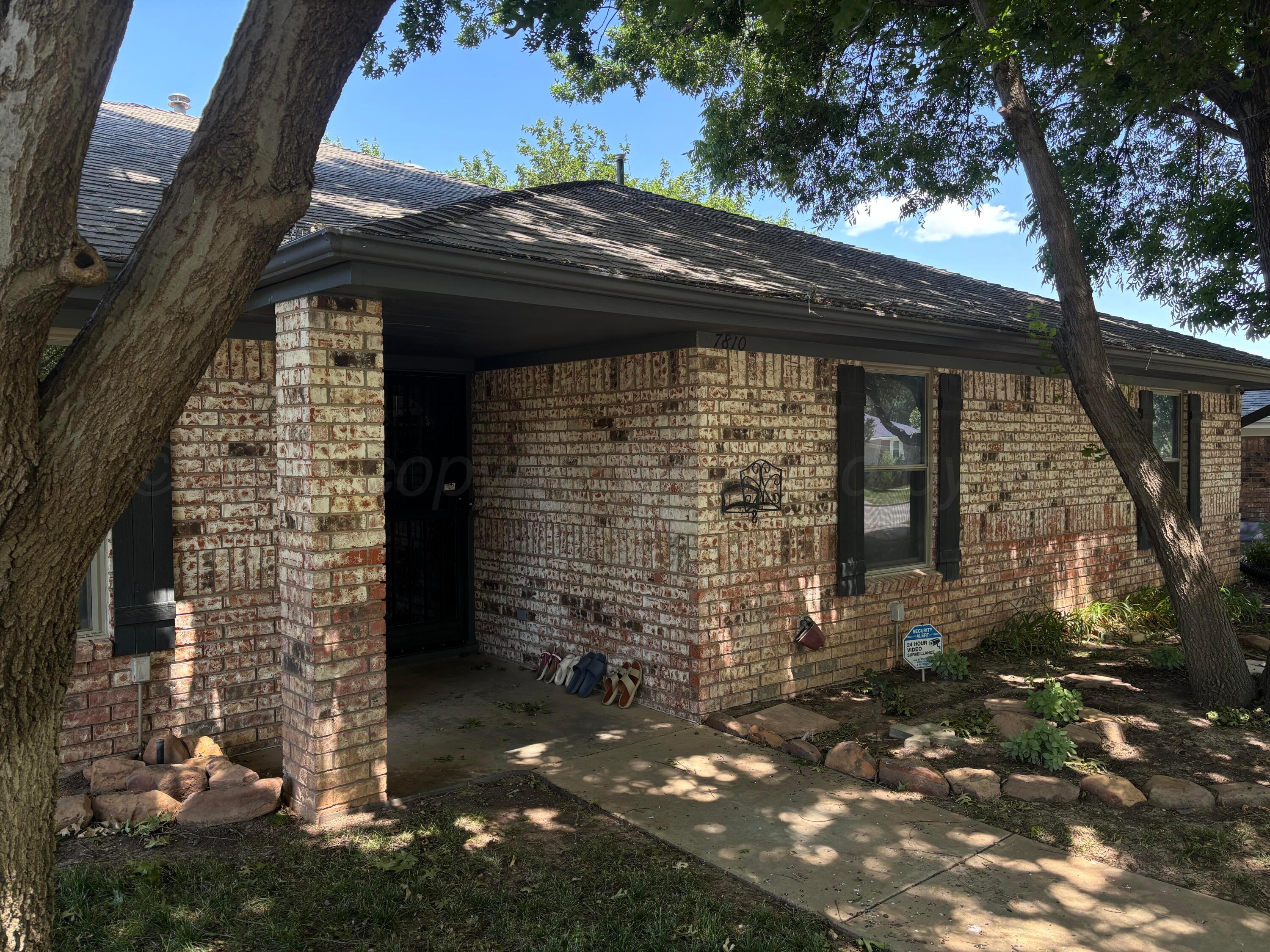 7810 Farrell Drive Amarillo, TX 79121 - Photo 4 of 31 a front view of a house with a tree