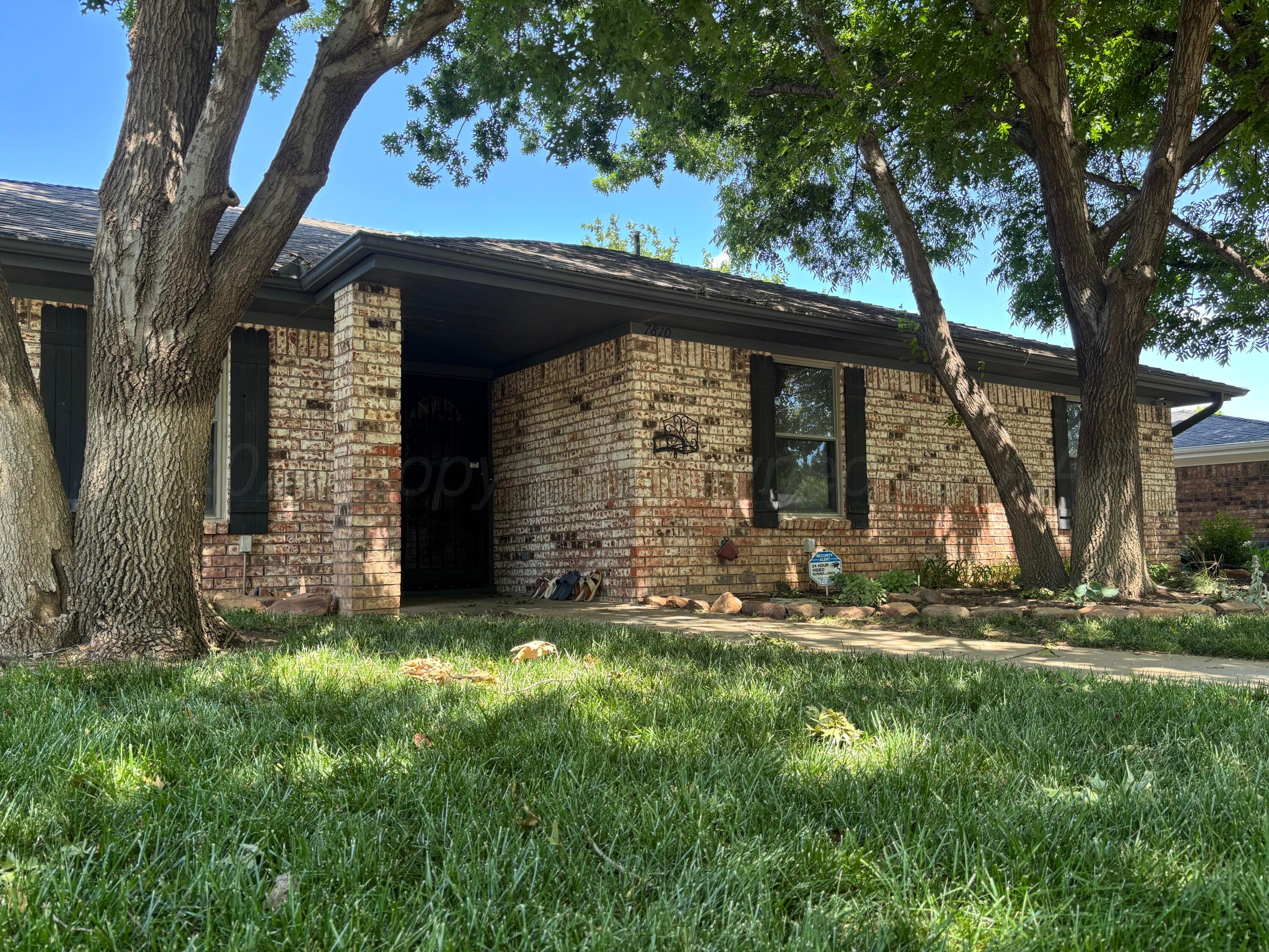 7810 Farrell Drive Amarillo, TX 79121 - Photo 6 of 31 a view of a house with a yard