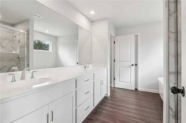 a bathroom with a bathtub and a sink