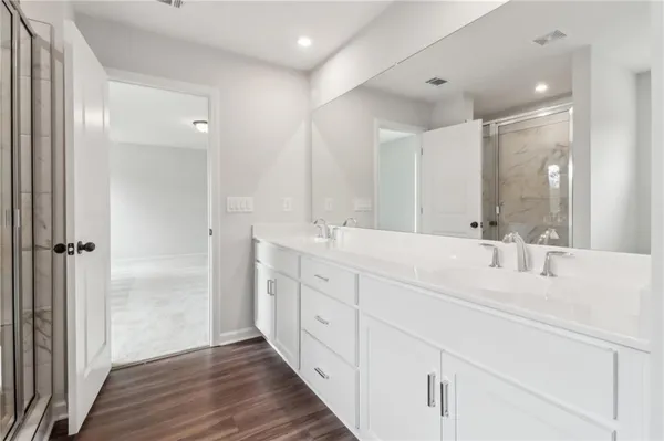 a white bath tub sitting next to a bathroom