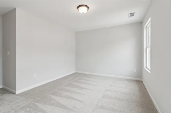 a bathroom with a bathtub shower sink vanity and toilet