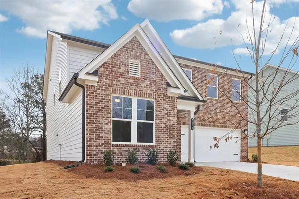 a view of a house with a yard
