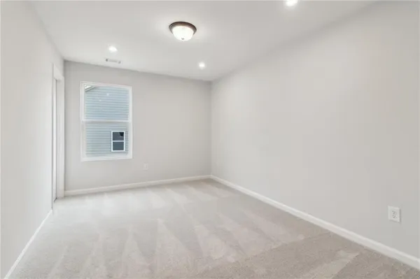 an empty room with shelves