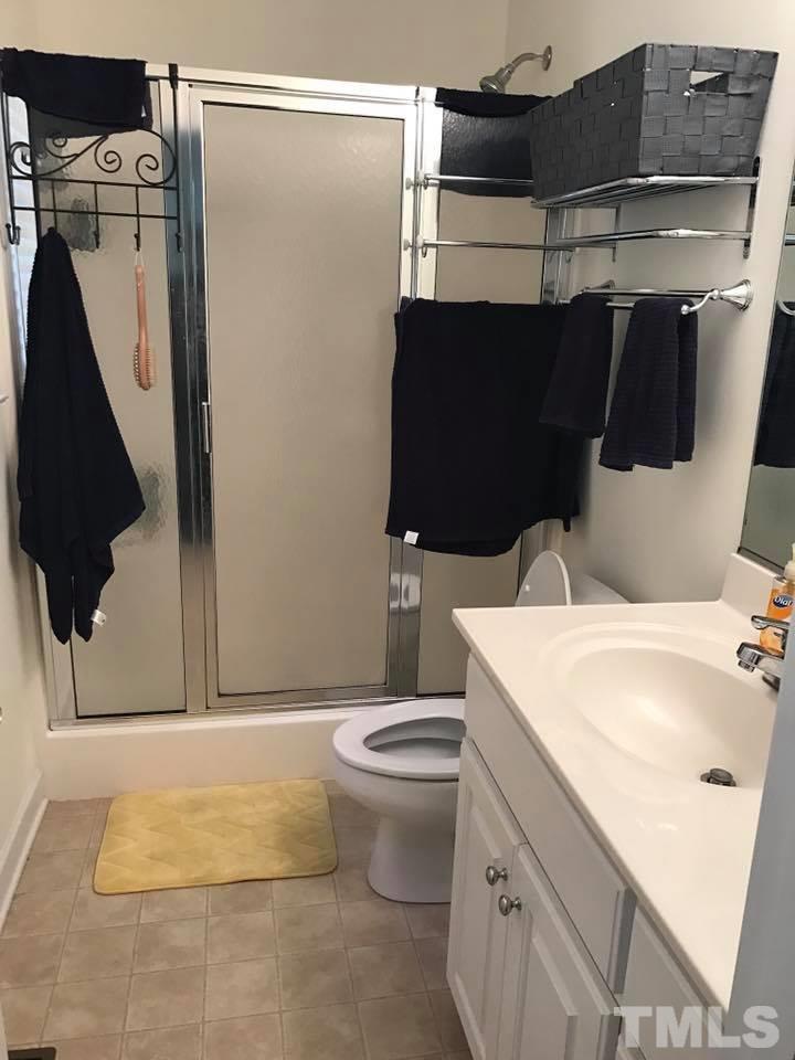 205 Hidden Hills Road Roxboro, NC 27574 - Photo 14 of 18 a bathroom with a sink and a mirror