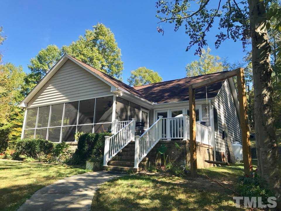 205 Hidden Hills Road Roxboro, NC 27574 - Photo 3 of 18 a view of a house with a yard