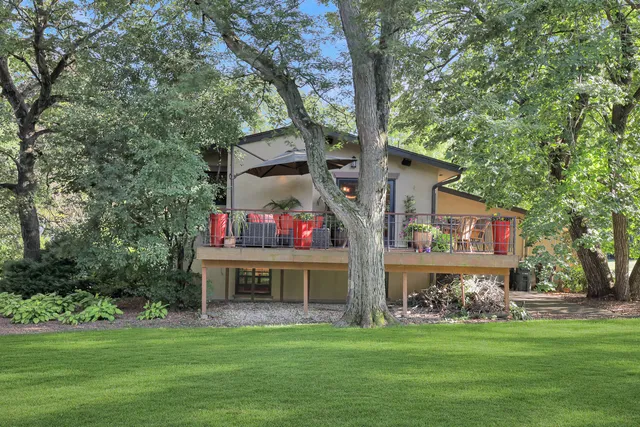 a front view of house with yard outdoor seating and green space