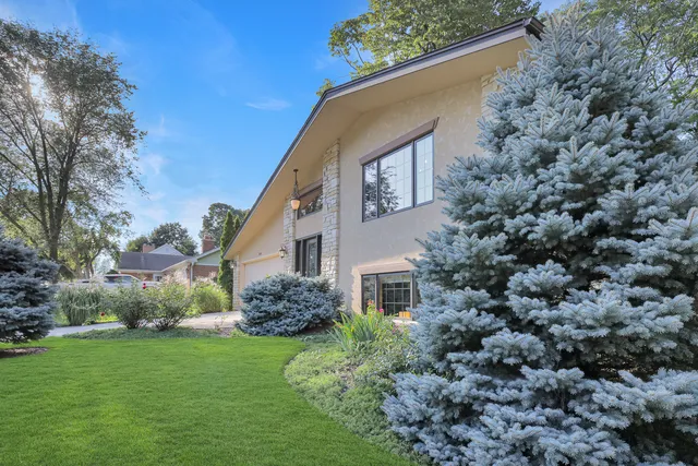 a view of house with yard outdoor seating and green space
