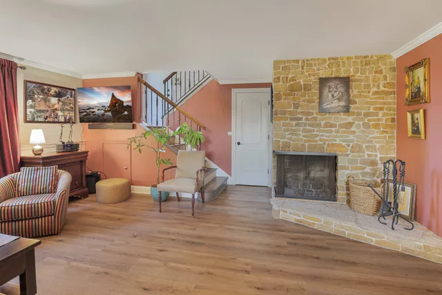 a living room with furniture and a fireplace
