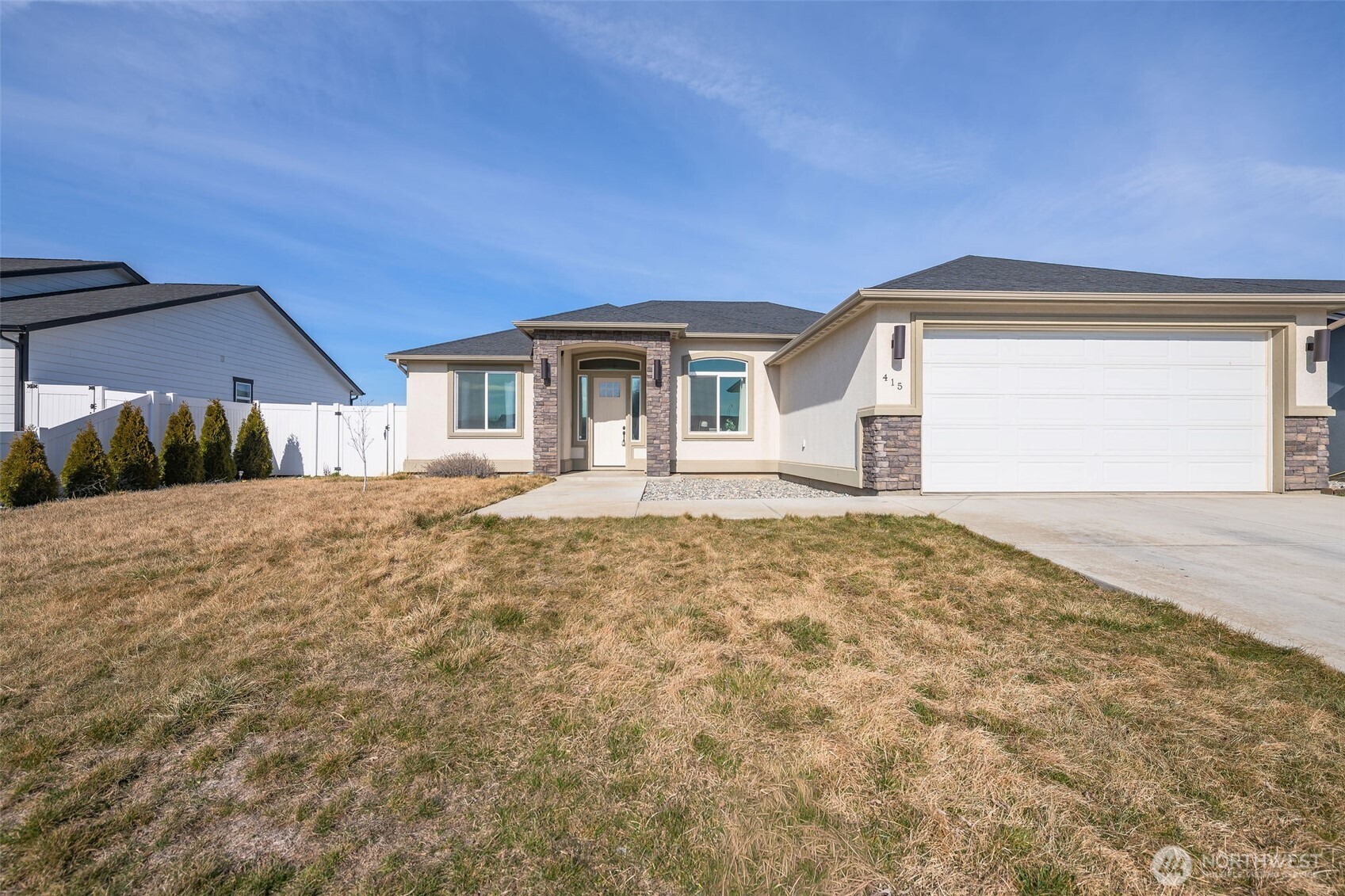 a front view of a house with a yard