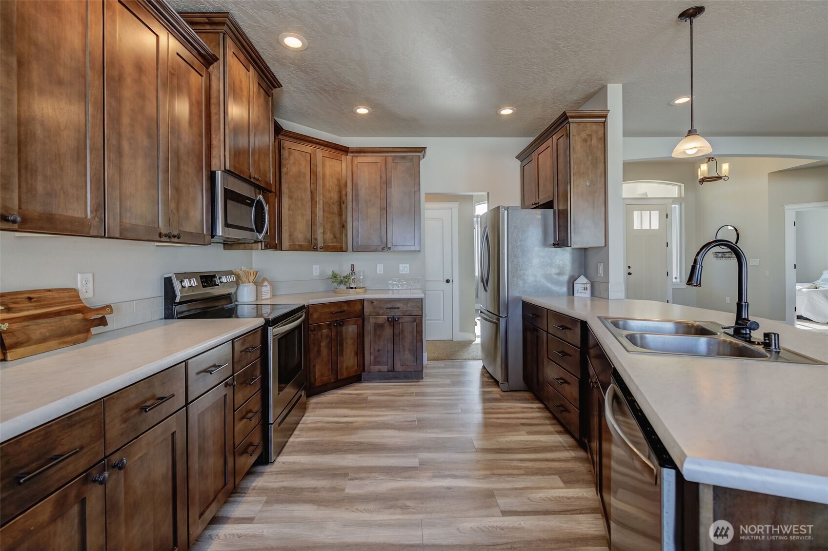 415 R Street Southwest Quincy, WA 98848 - Photo 11 of 33 a kitchen with stainless steel appliances a sink stove and refrigerator