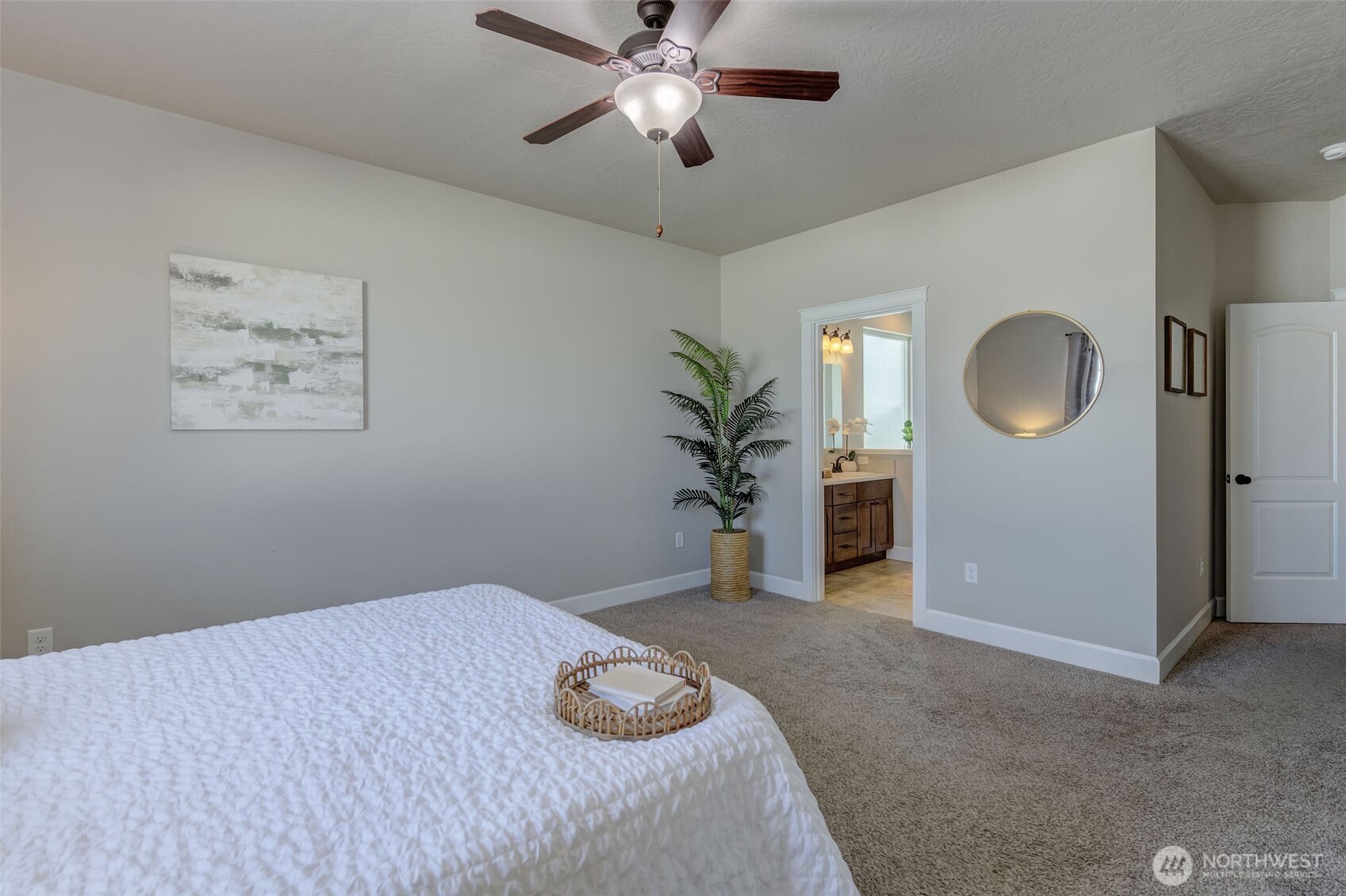 415 R Street Southwest Quincy, WA 98848 - Photo 15 of 33 a bedroom with a bed and a chandelier