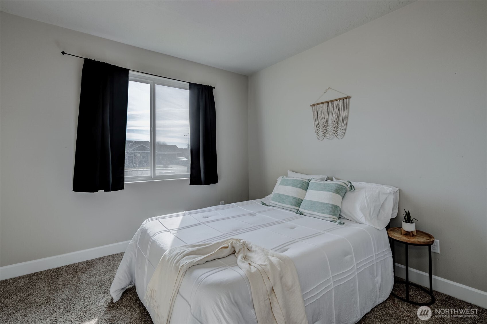 415 R Street Southwest Quincy, WA 98848 - Photo 21 of 33 a bedroom with a bed and a window