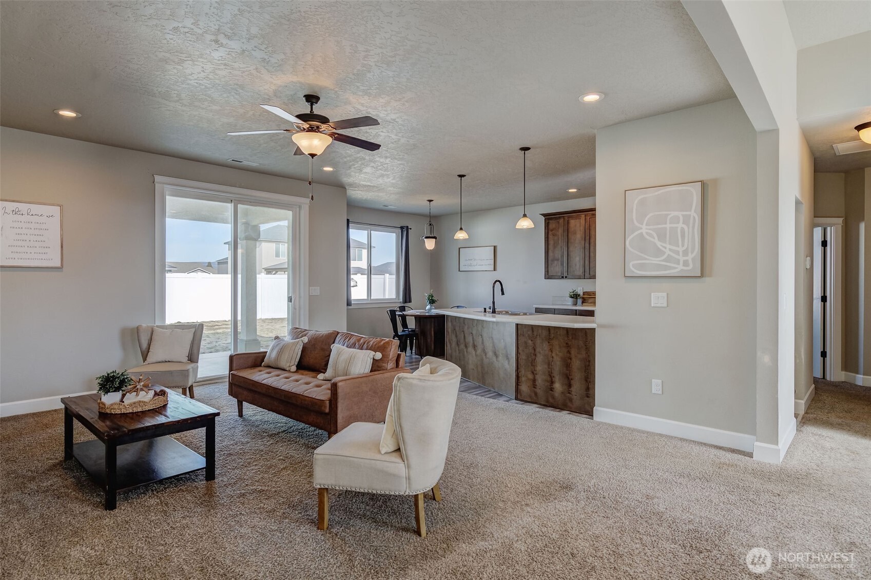 415 R Street Southwest Quincy, WA 98848 - Photo 6 of 33 a living room with furniture a ceiling fan and a window