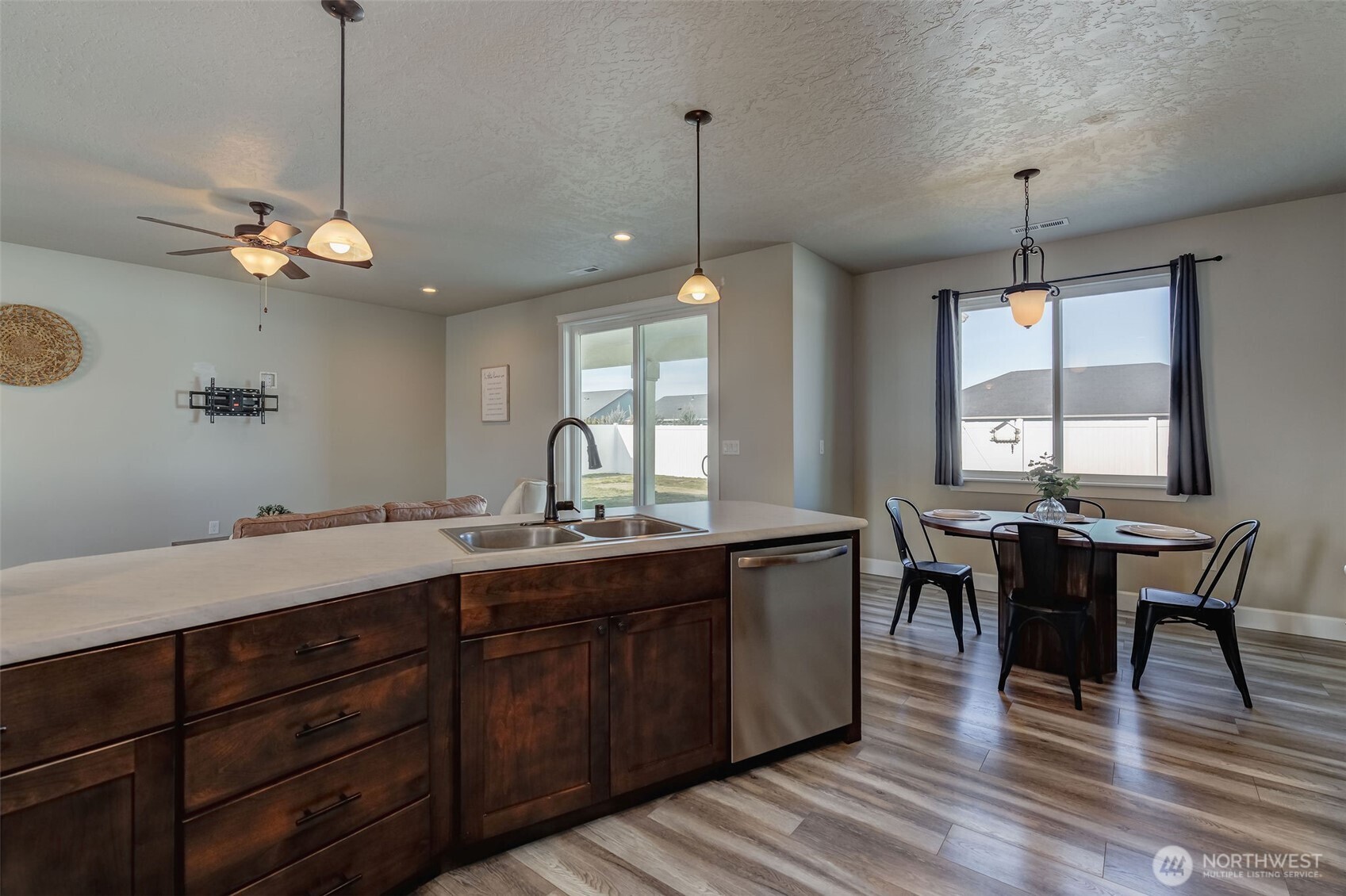 415 R Street Southwest Quincy, WA 98848 - Photo 9 of 33 a view of a dining room and livingroom with furniture wooden floor a chandelier