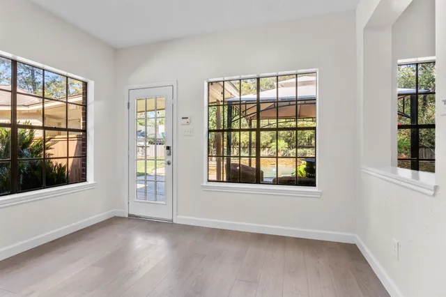a view of entryway with wooden floor