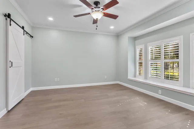 a view of an empty room with a window