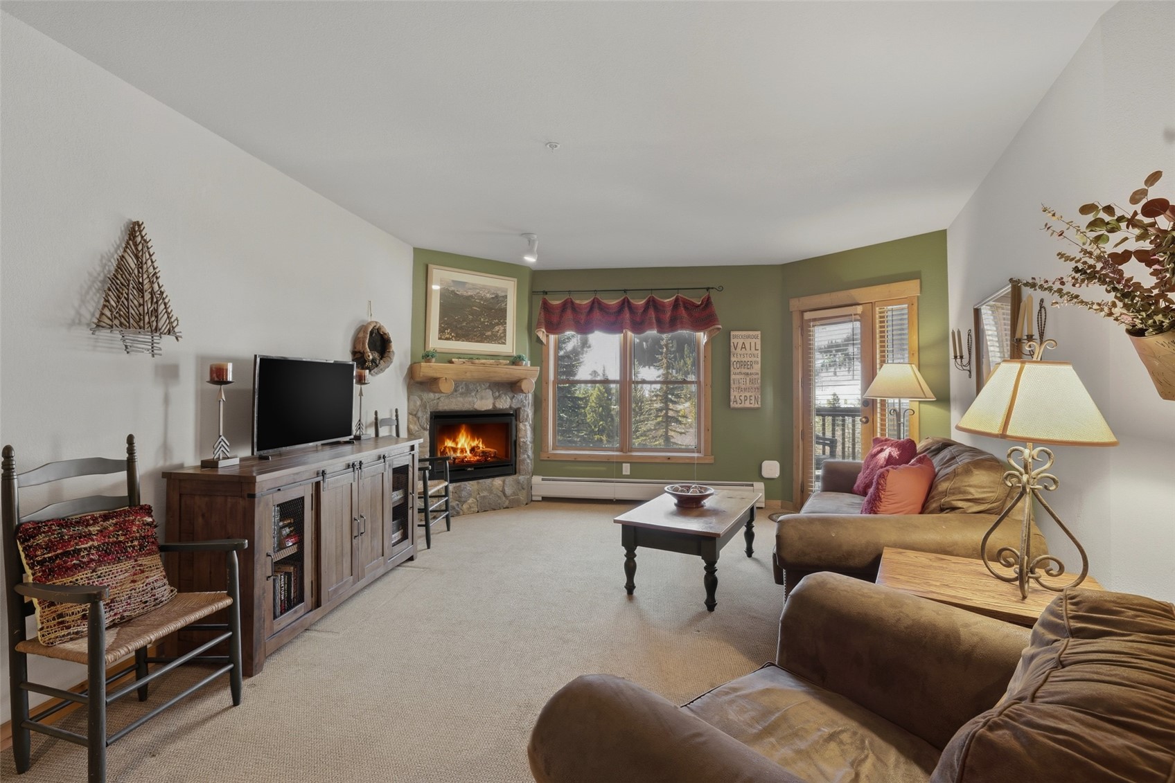 22784 Highway 6, Unit 2628 Keystone, CO 80435 - Photo 14 of 45 a living room with furniture and a flat screen tv