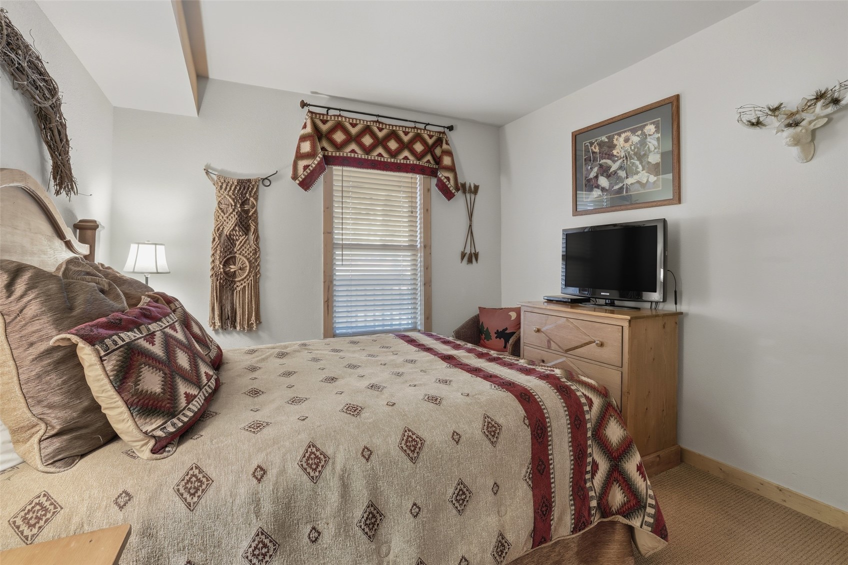 22784 Highway 6, Unit 2628 Keystone, CO 80435 - Photo 19 of 45 a bedroom with a bed and a flat screen tv