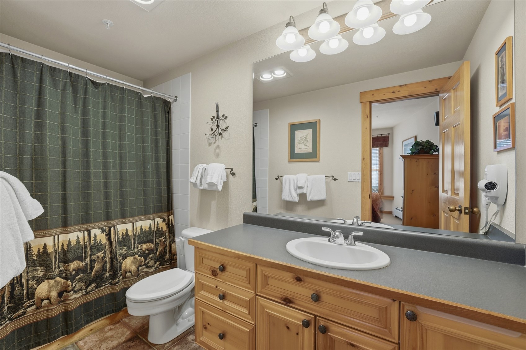 22784 Highway 6, Unit 2628 Keystone, CO 80435 - Photo 19 of 45 a bathroom with a granite countertop sink and a mirror