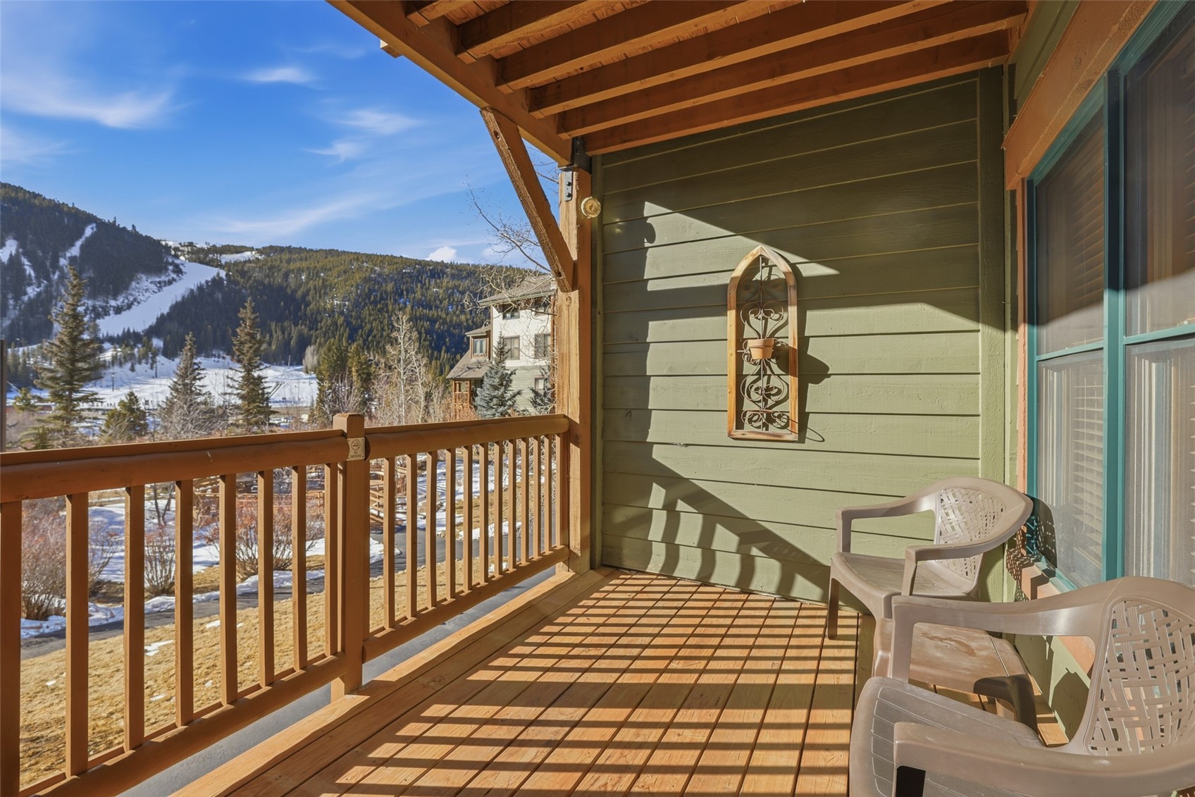 22784 Highway 6, Unit 2628 Keystone, CO 80435 - Photo 2 of 45 a view of balcony with wooden floor and outdoor seating
