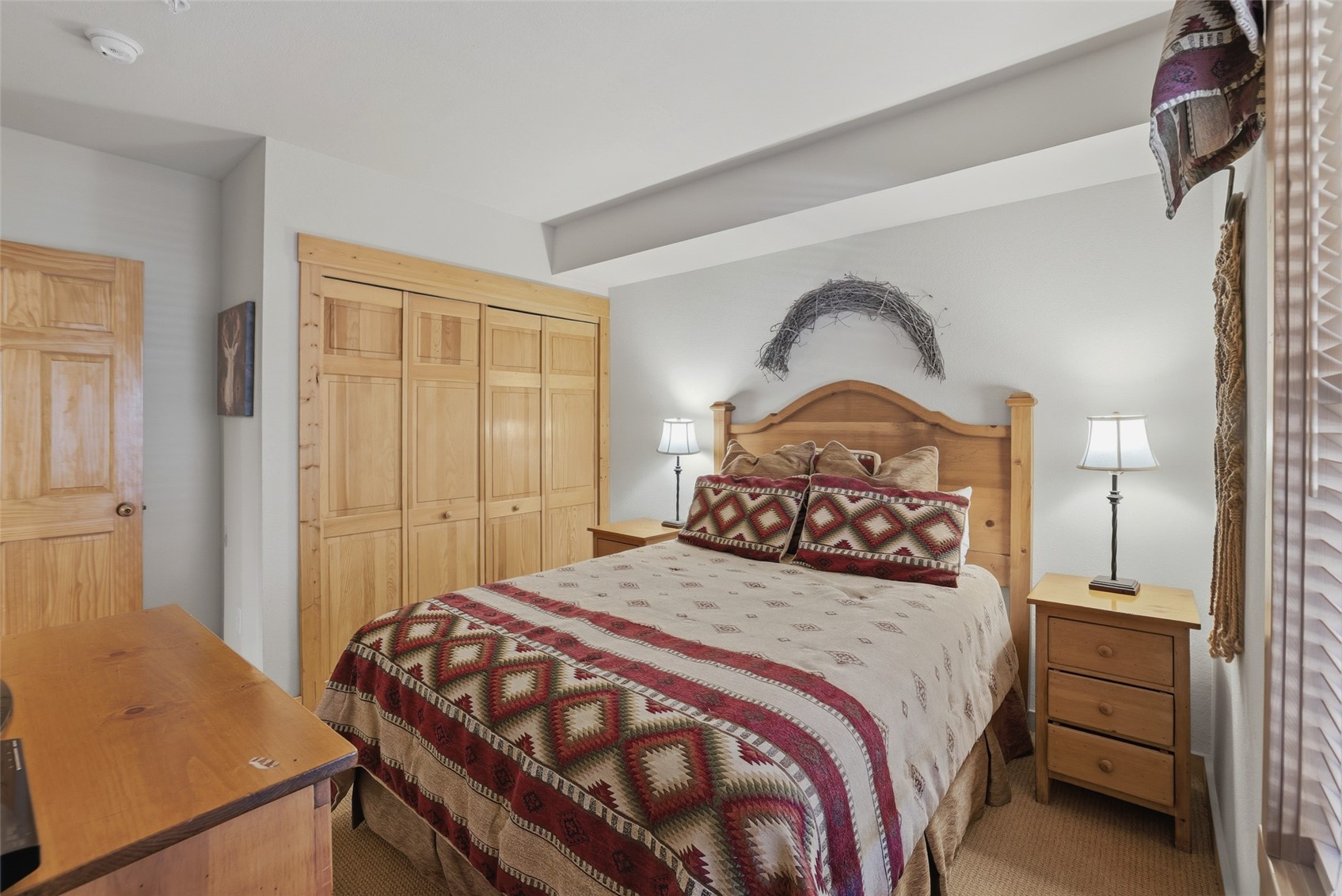 22784 Highway 6, Unit 2628 Keystone, CO 80435 - Photo 21 of 45 a bedroom with a bed and a closet