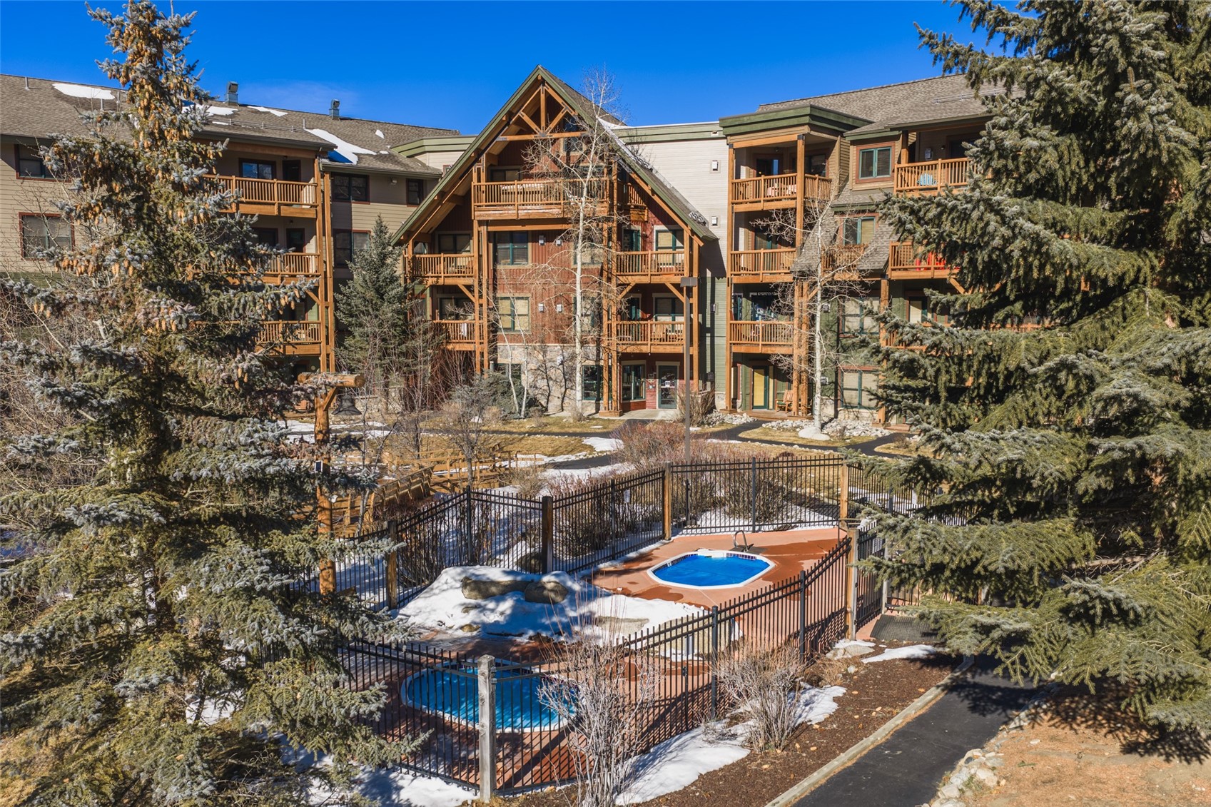 22784 Highway 6, Unit 2628 Keystone, CO 80435 - Photo 25 of 45 a view of a blue and white house with a yard