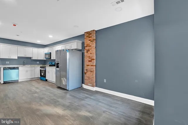 a view of a kitchen with a sink