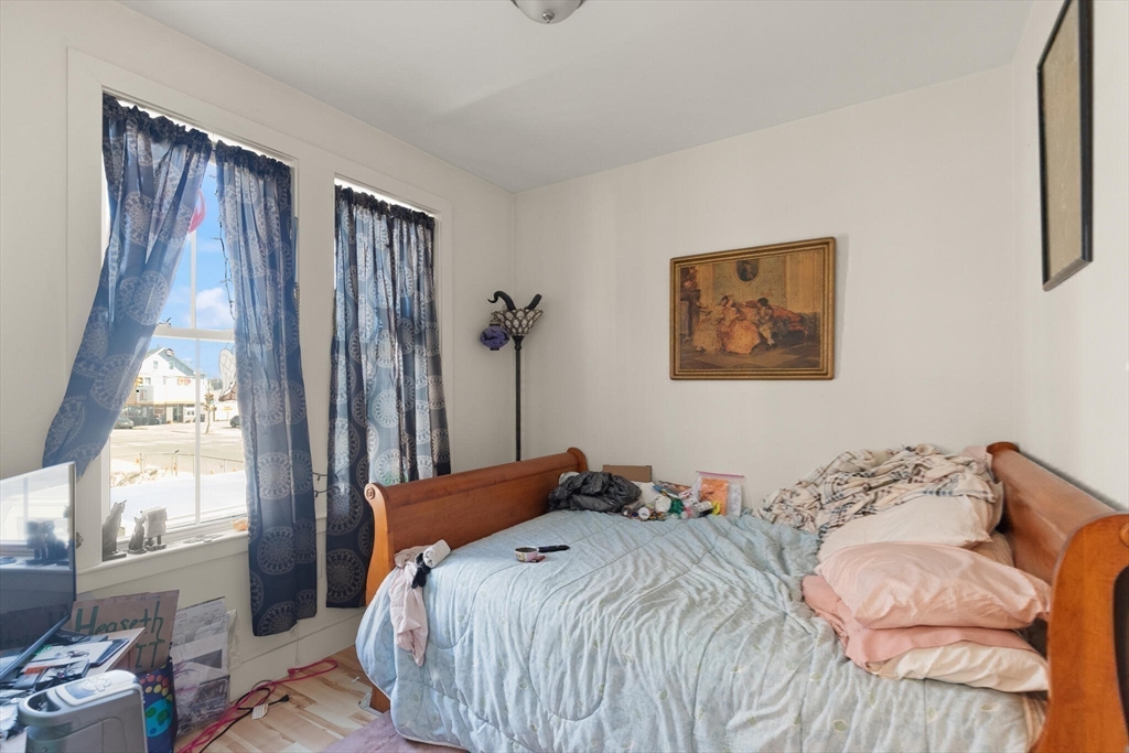 145 Lewis Street Lynn, MA 01902 - Photo 18 of 32 a bedroom with a bed and a window
