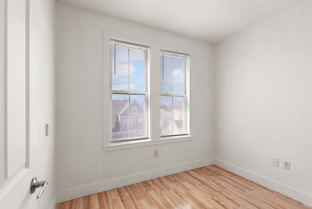 145 Lewis Street Lynn, MA 01902 - Photo 19 of 32 an empty room with a window