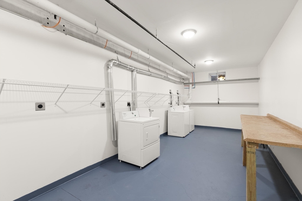 145 Lewis Street Lynn, MA 01902 - Photo 28 of 32 a utility room with cabinets dryer and washer