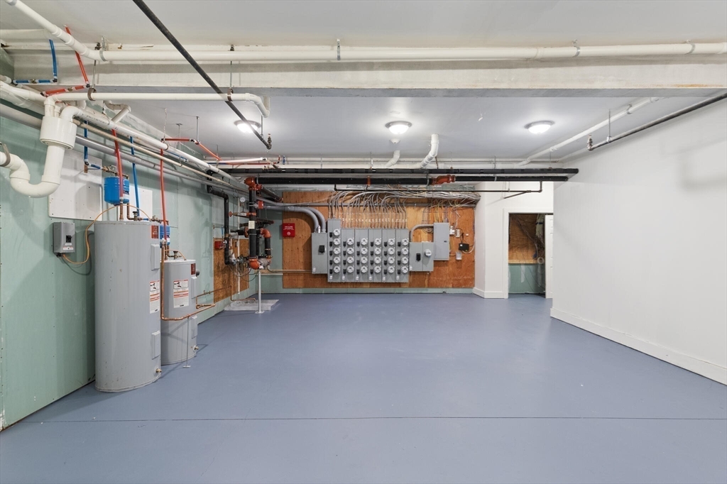 145 Lewis Street Lynn, MA 01902 - Photo 31 of 32 a view of room with refrigerator and washer